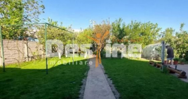 Casă individuală cu sistem fotovoltaic, curte amenajat?...