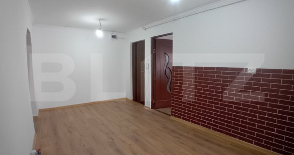 Apartament renovat cu 2 camere decomandate și garaj în Dum