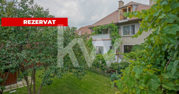 REZERVAT - Apartament cu 3 camere, garaj, terasă și teren