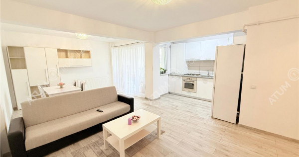 Apartament cu 2 camere 56 mp utili mobilat etaj 1 si loc de